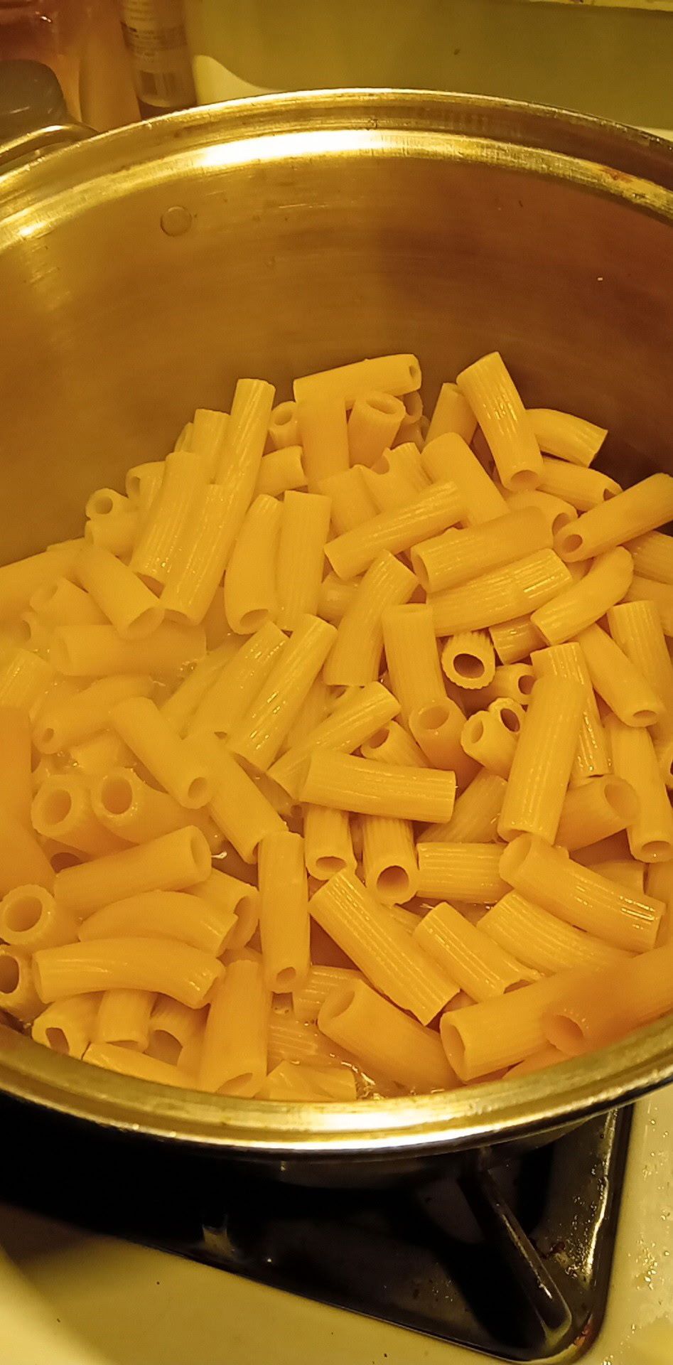 Rigatoni cooking in a large pot